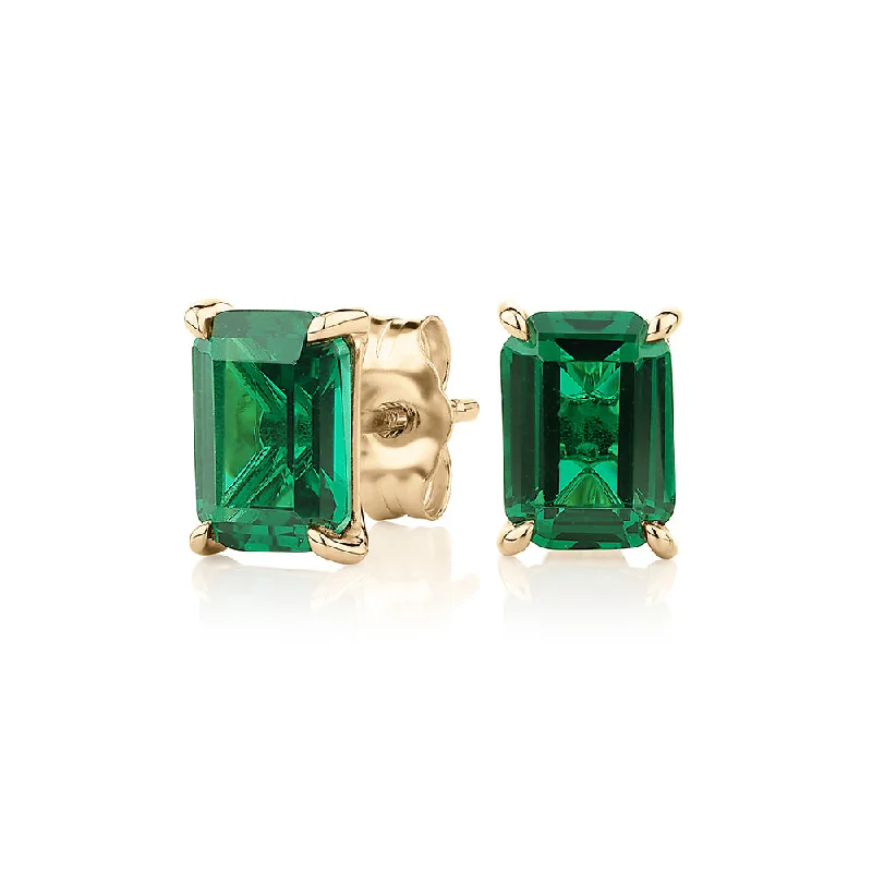 Rose Gold Drop Earrings-Emerald Cut stud earrings with emerald simulants in 10 carat yellow gold