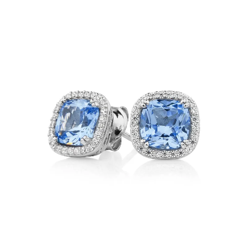 Layered Gold Earrings-Cushion and Round Brilliant halo stud earrings with blue topaz simulants and 2.81 carats* of diamond simulants in sterling silver