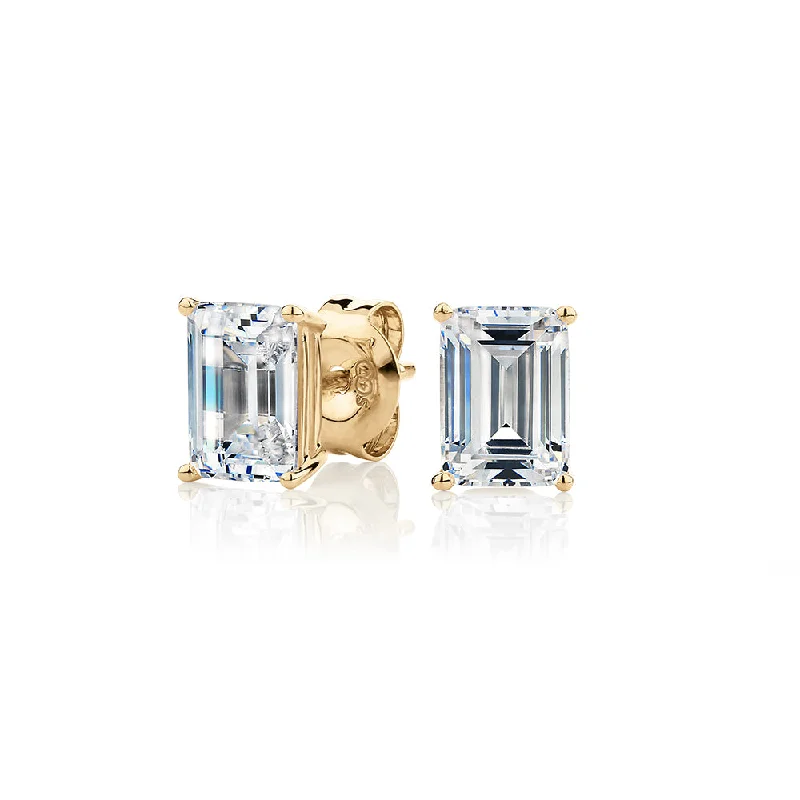 Diamond Stud Earrings-Emerald Cut stud earrings with 2 carats* of diamond simulants in 10 carat yellow gold