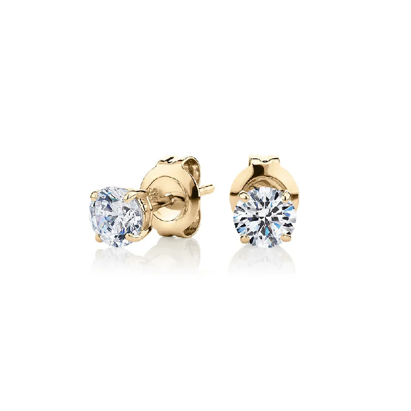 Antique Style Earrings-Round Brilliant stud earrings with 0.75 carats* of diamond simulants in 10 carat yellow gold